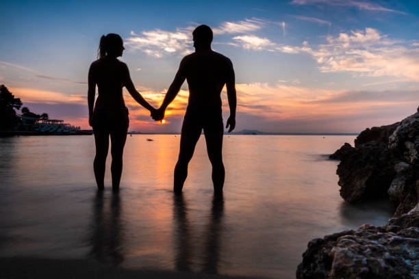 istock Couple standing in the sea at sunset in Mallorca 1064250064