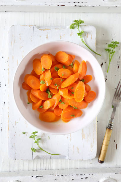 istock Vegetarian cuisine. Stewed carrots and fresh parsley 1064250146