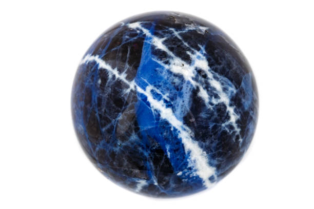 istock Macro mineral stone Sodalite ball on white background 1064250538