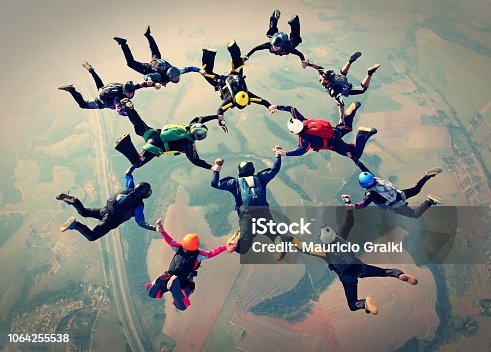 istock Skydivers team work photo effect 1064255538