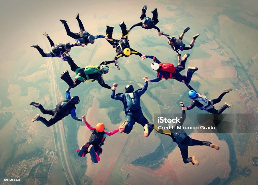 Skydivers team work photo effect Skydivers formation Teamwork Stock Photo