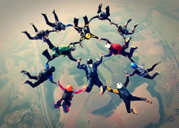 Photo of Skydivers team work photo effect