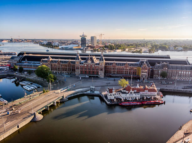 istock Amsterdam Central railway Station aerial view at Sunrise 1064257892