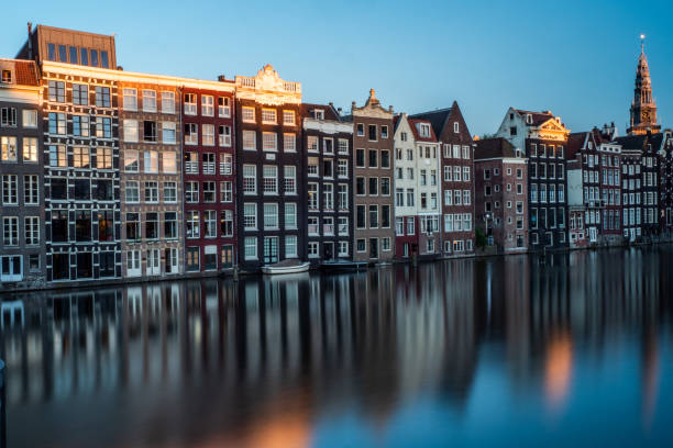 istock Amsterdam Classic Houses at the Canal - Netherlands 1064259936