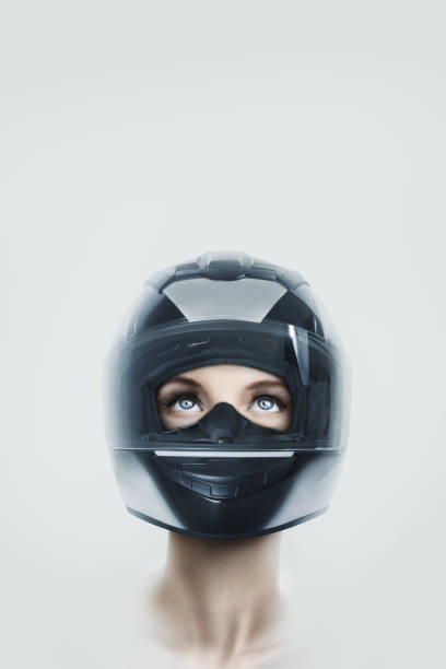 istock Young woman in motorcycle helmet 1064260524