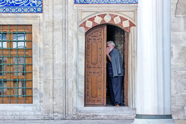 A muezzin calling for prayer in Mosque in Istanbul Istanbul, Turkey - October 06, 2018: A muezzin calling for prayer in Mosque in Istanbul mullah photos stock pictures, royalty-free photos & images