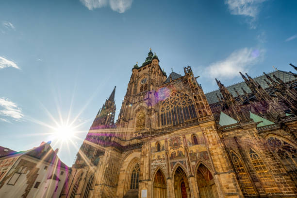 Prague Cathedral seen from bottom with the sun iluminating it.