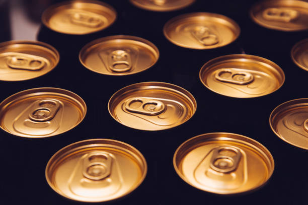 istock metal beer cans background black gold row 1064263670