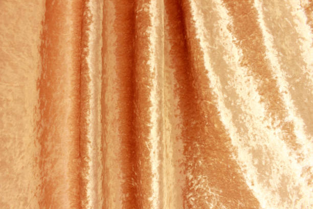 istock The soft drape of gold fabric 1064266778