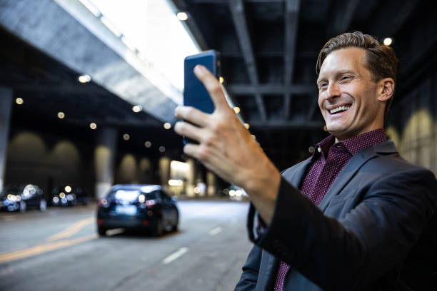 istock Business man in the city taking a selfie afterwork 1064268212