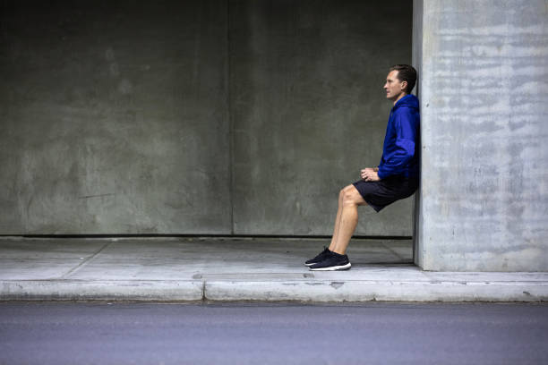 istock Athletic man running and getting fit in the city downtown after work 1064271192