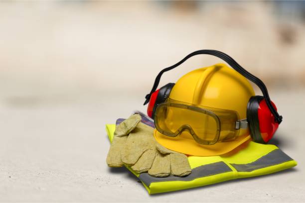 Safety. Safety helmet with earphones and goggles on construction background protective workwear stock pictures, royalty-free photos & images