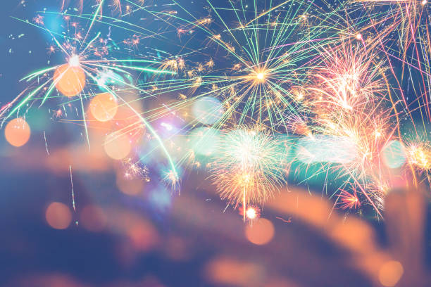istock Background festive New Year with fireworks and bokeh. 1064274080