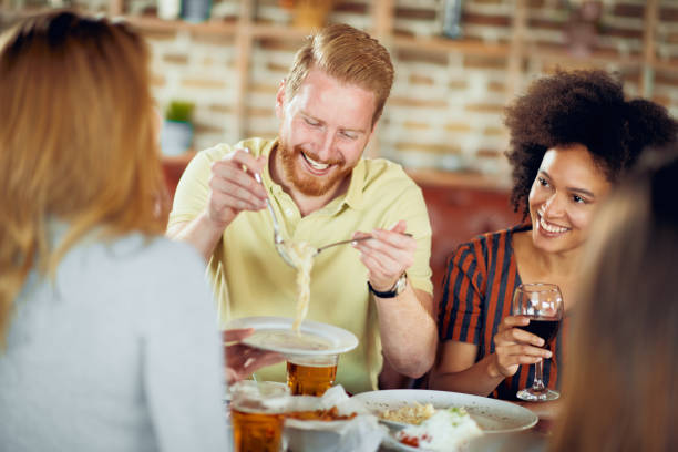istock Friends having dinner at restaurant. 1064274118