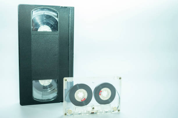 istock analog audio cassette and analog video cassette nearby, on a white background 1064274342