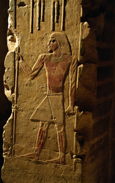 istock Ancient egyptian hieroglyphs carved on the stone wall 1064275760