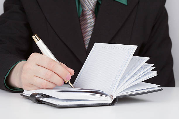 istock Woman does records in a diary close up 106427580
