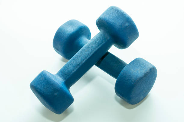 istock blue dumbbells for sports on a white background 1064276116