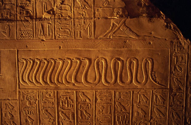 istock Ancient egyptian hieroglyphs carved on the stone wall 1064288008