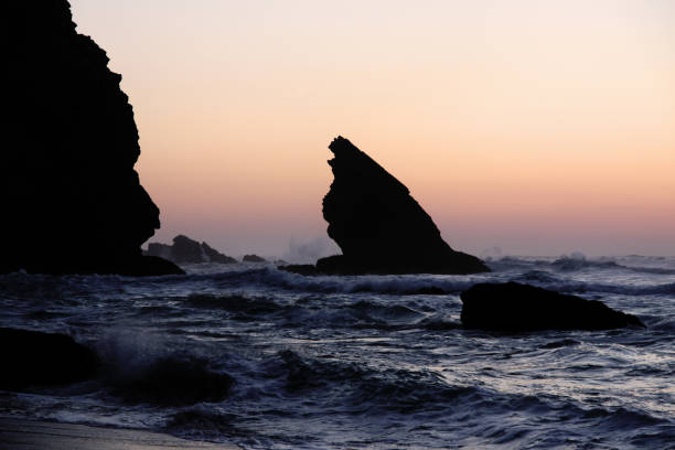 istock rocky shore and violent sea waves on Adraga Beach 1064292146