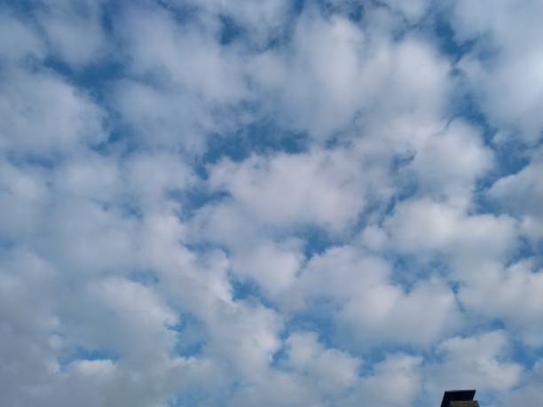 istock Fantastic November cloud sky over roof top 1064294572