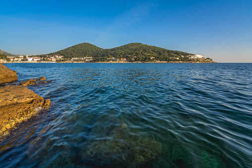 Beautiful rocky Croatian coast in Dubrovnik Lapad area in summer, Croatia