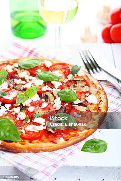 Pizza With Mushrooms Tomatoes And Cheese Stock Photo - Download Image Now - Basil, Cheese, Close-up