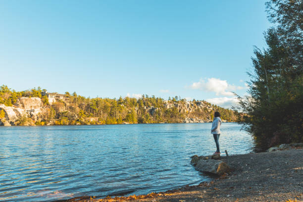istock Woman walking on trail in autumn 1064303692