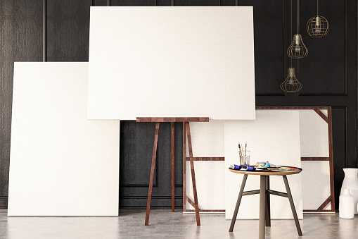 Empty Canvas against black wall