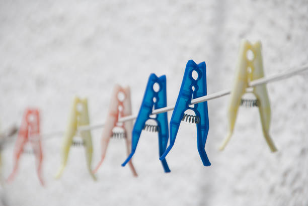 Colorful clothespins on the rope