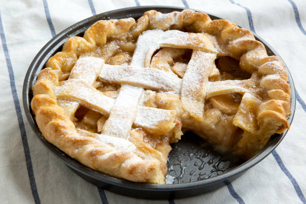istock Home-baked apple pie on cloth, side view. Close-up. 1064309764