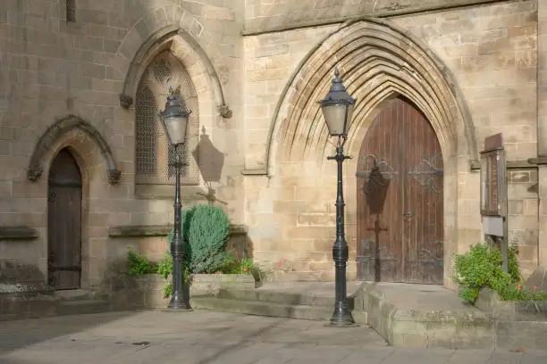 Church cathedral medieval building entrance early morning sunlight uk