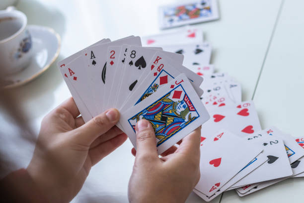 istock Woman with Playing Cards 1064312442