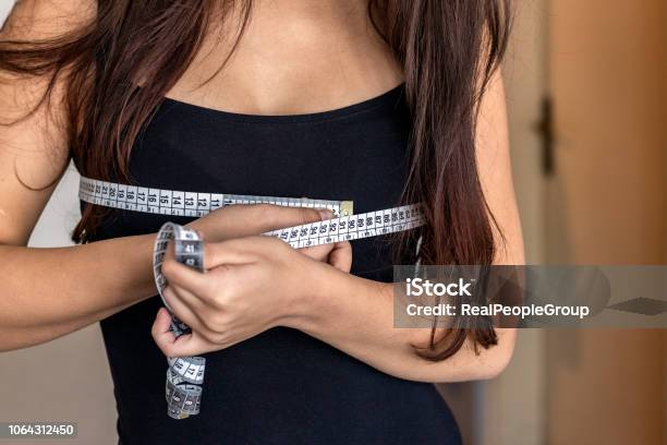 Woman With Measure Tape Stock Photo - Download Image Now - 25-29 Years, Abdomen, Achievement