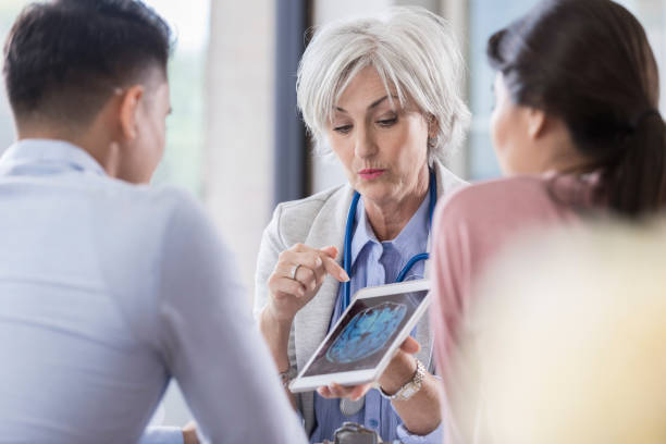 istock Doctor discusses patient's test results 1064312712