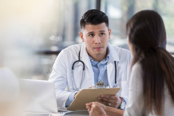 istock Attentive doctor listens to patient 1064312740