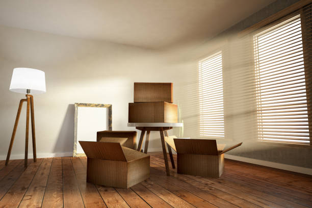 istock Moving into a new house Concept with Cardboard Boxes 1064315620