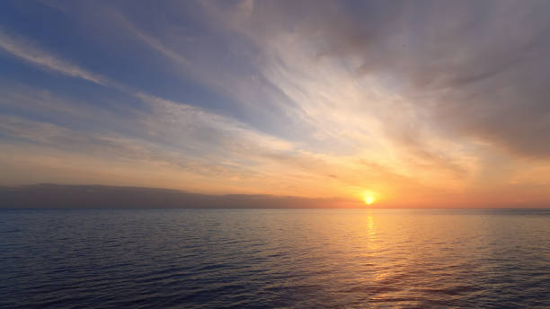 istock early morning sunrise on a choppy river 1064318732