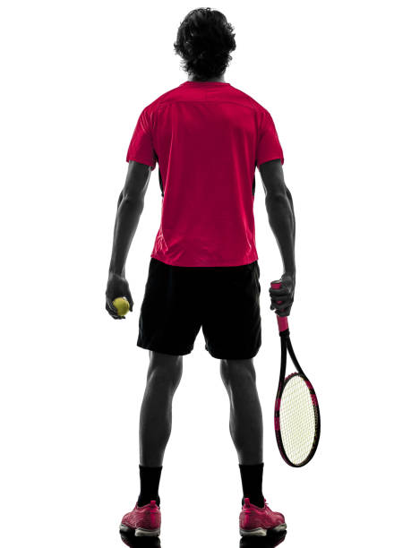 one caucasian hispanic tennis player man in studio silhouette isolated on white background