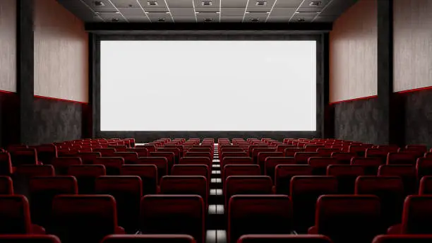 Photo of Empty Movie Theater with Red Seats and Blank Screen