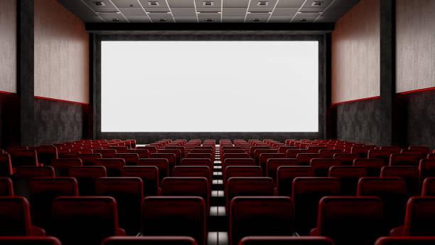 empty movie theater with red seats and blank screen - empty theater imagens e fotografias de stock