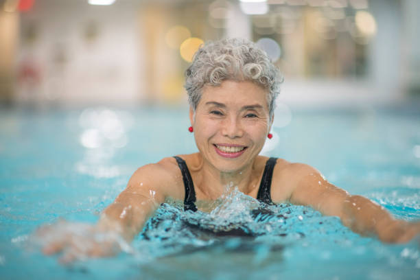 istock Senior women swimming 1064330464