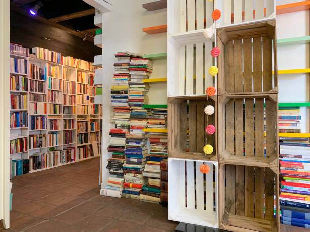 istock Planning the new library - unsorted book stacks and empty shelves 1064338518