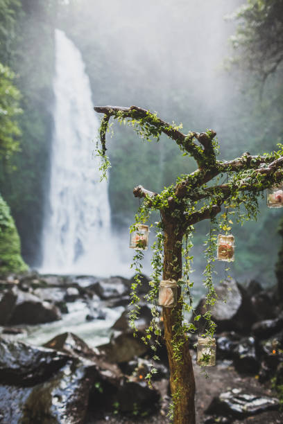istock Wedding ceremony in jungle with waterfall view 1064351036