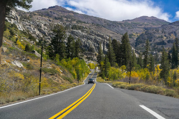 Driving through the Sierra mountains towards Sonora pass on a sunny autumn day, California
