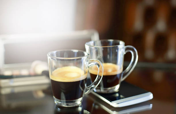 istock Cup of coffee with the phone and make-up set and brushes 1064362966