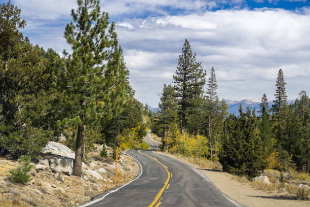 istock Road going through the Sierra mountains, California 1064364752
