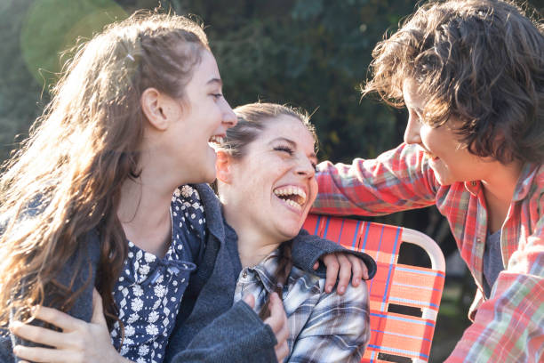 istock Beautiful family at the ranch having fun laughing and talking 1064366418