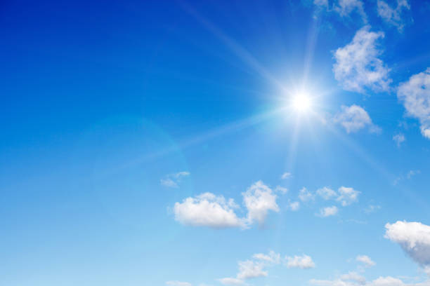 istock clouds against a blue sky with rays of the sun 1064370516