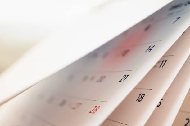 istock Abstract blur calendar page flipping sheet close up background 1064370680
